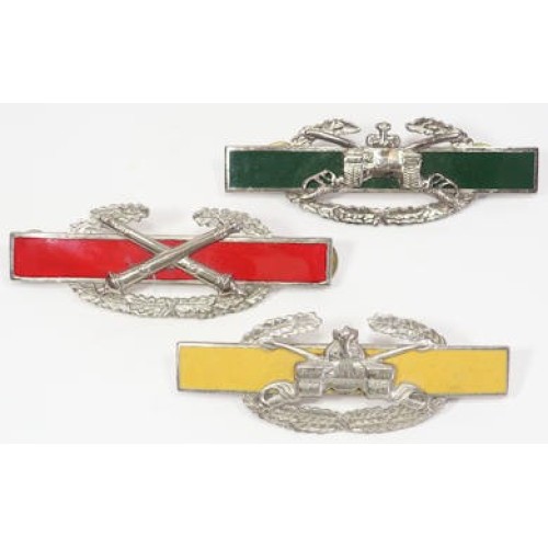 US4537.)SET OF THREE COMBAT NOVELTY BADGES